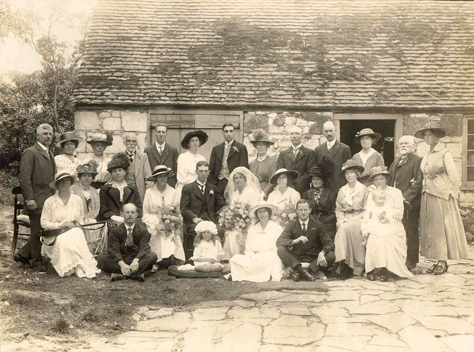 The marriage of Stewart Child and Rosalie Barton at Brighstone Church (Isle of Wight) on 21st August 1916.  This was the occasion where Helen Kegie’s parents met.  Amy Child is the bridesmaid sitting next to the groom with a black band showing on her hat.  Alfred Quinton Barton sits in the front with his hand raised.  